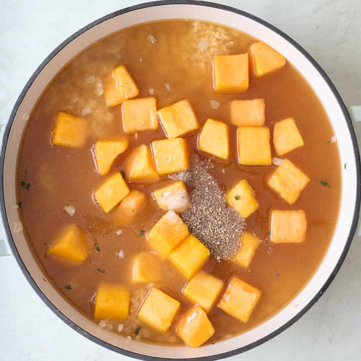 Ingredients for recipe in a pot before cooking.