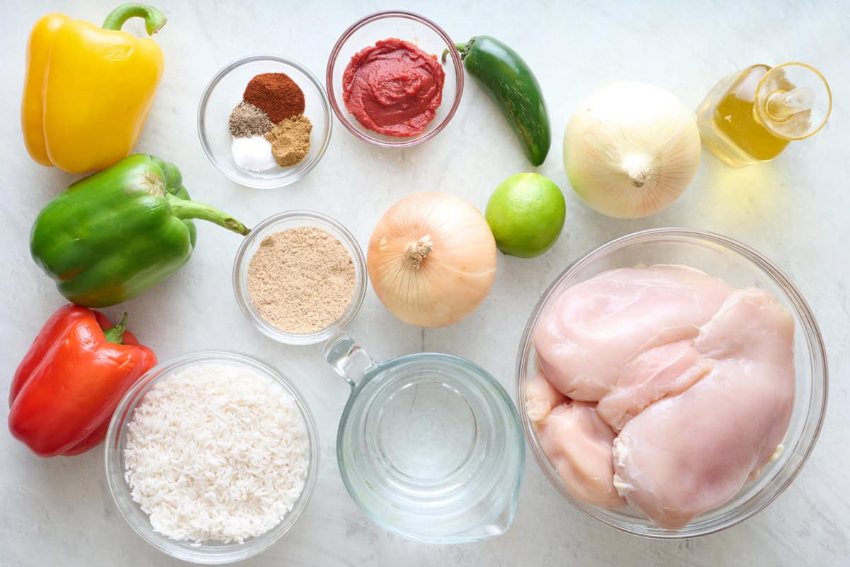 Ingredients for recipe: bell peppers, spices, tomato pasta, rice, onion, lime, jalapeno, onion, chicken breast and oil.