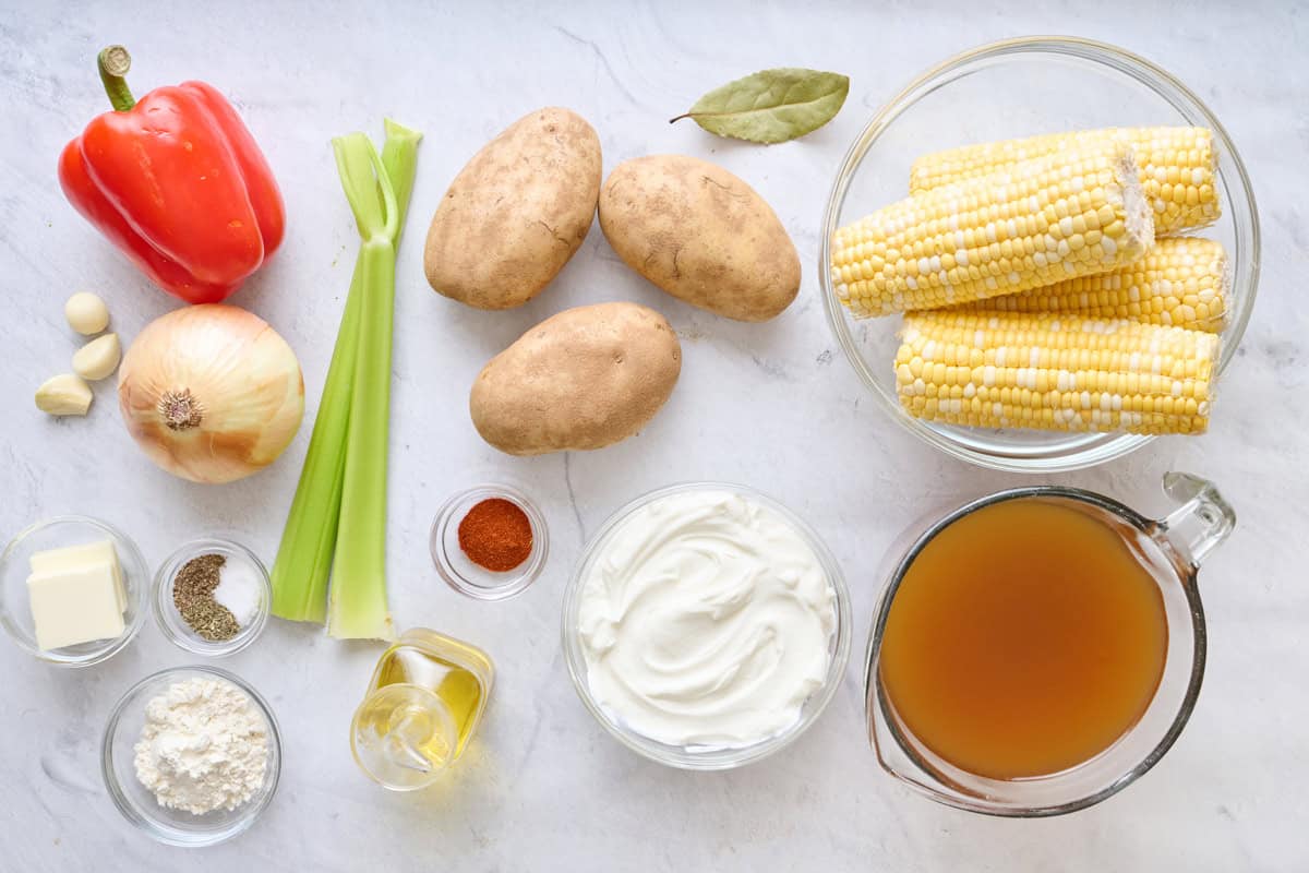 Ingredients for recipe: red pepper, garlic, onion, celery, potatoes, corn cobs butter, salt, pepper, and dried thyme, flour, oil, smoked paprika, bay leave, greek yogurt, and vegetable broth.