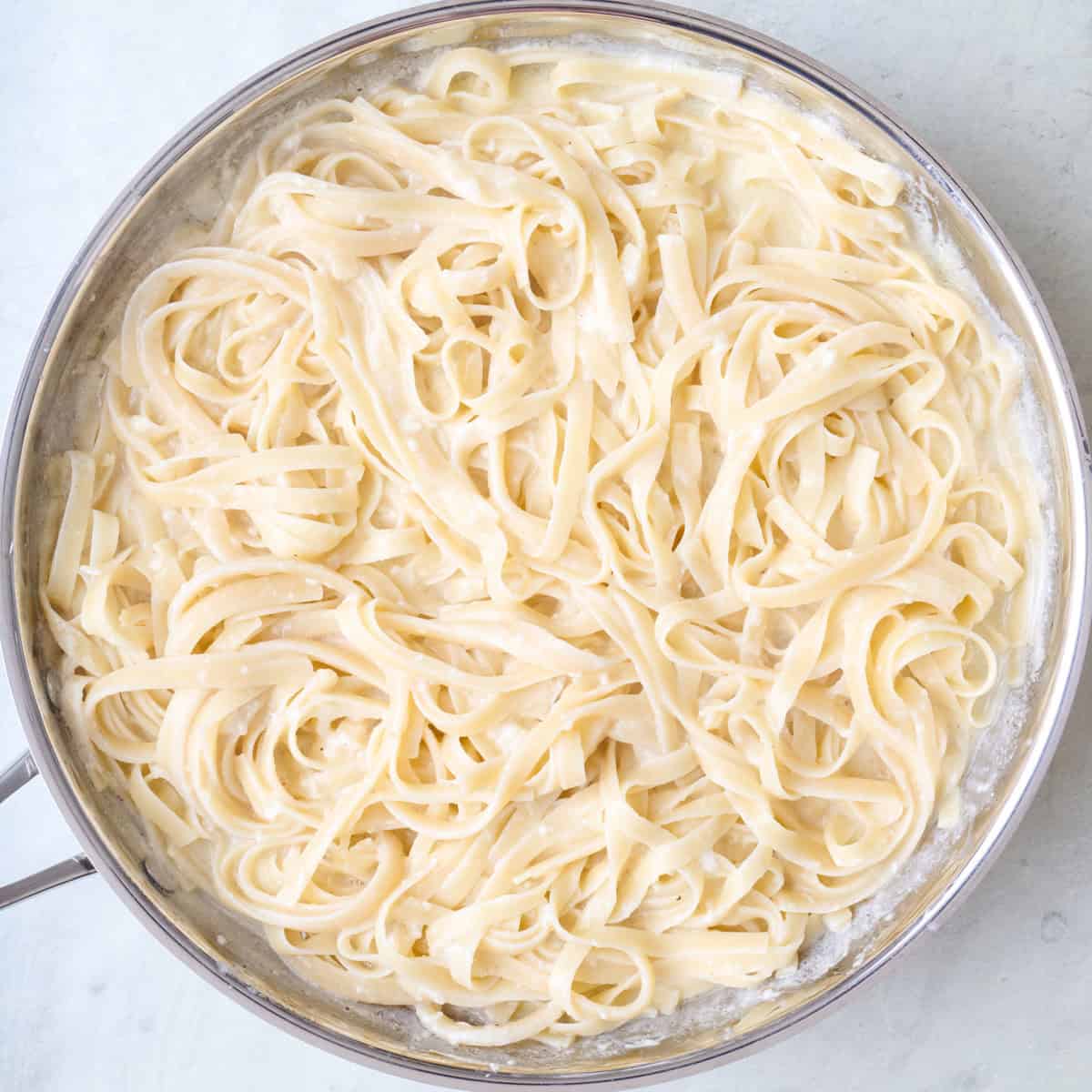 Final fettuccine in the saucepan.