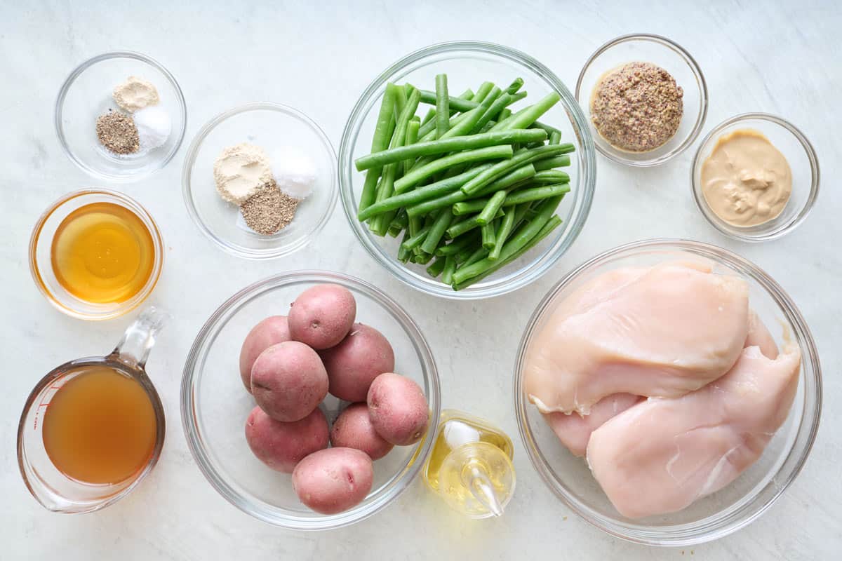 Ingredients for recipe: chicken, green beans, potatoes, seasonings, 2 types of mustard, broth, and oil.