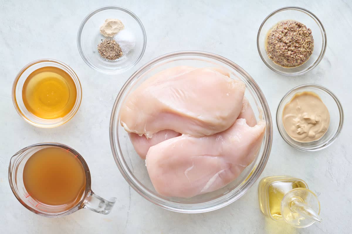 Ingredients for recipe: chicken breasts, broth, Dijon mustard, ground mustard, seasonings, and oil.