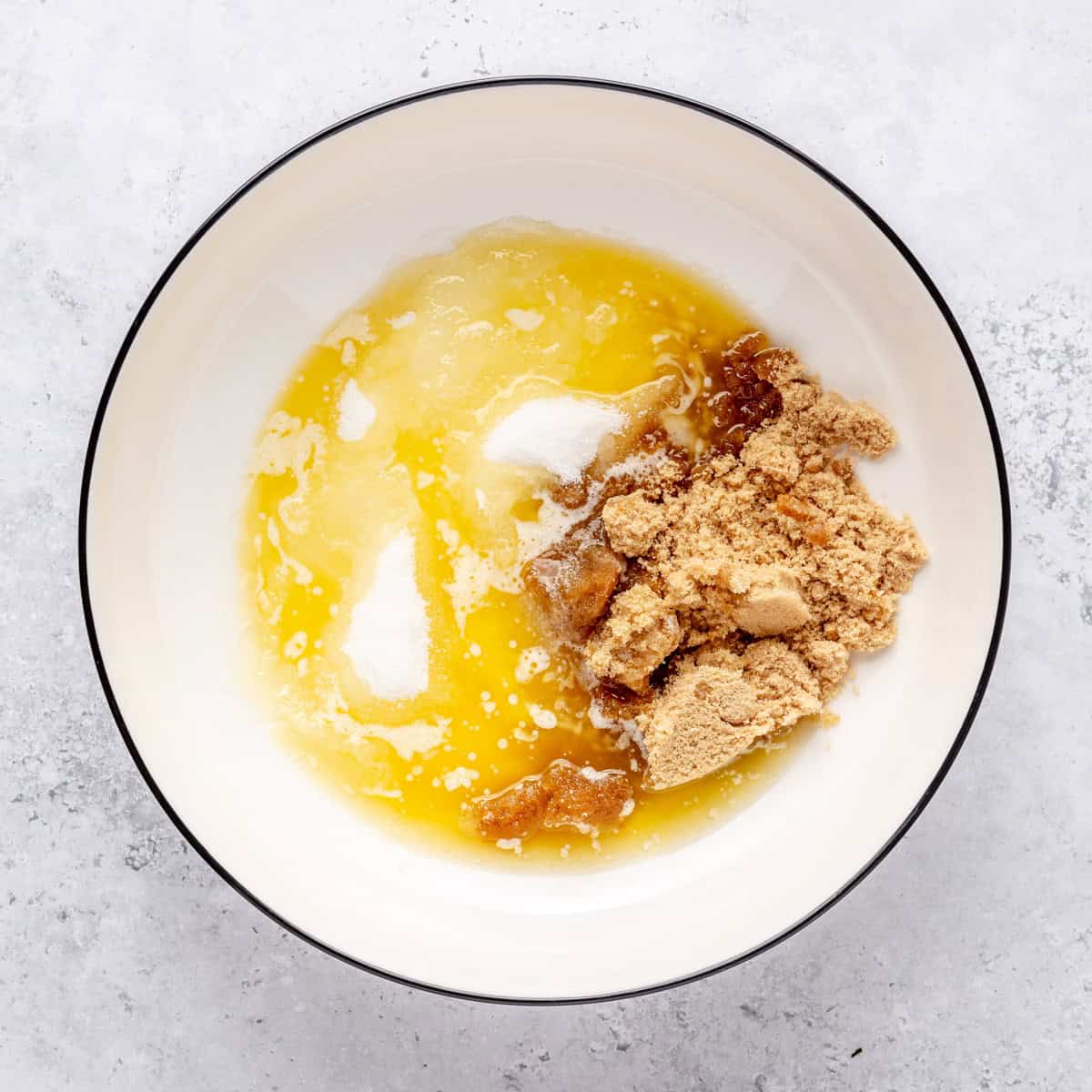 Butter and sugars in a medium bowl before combining.