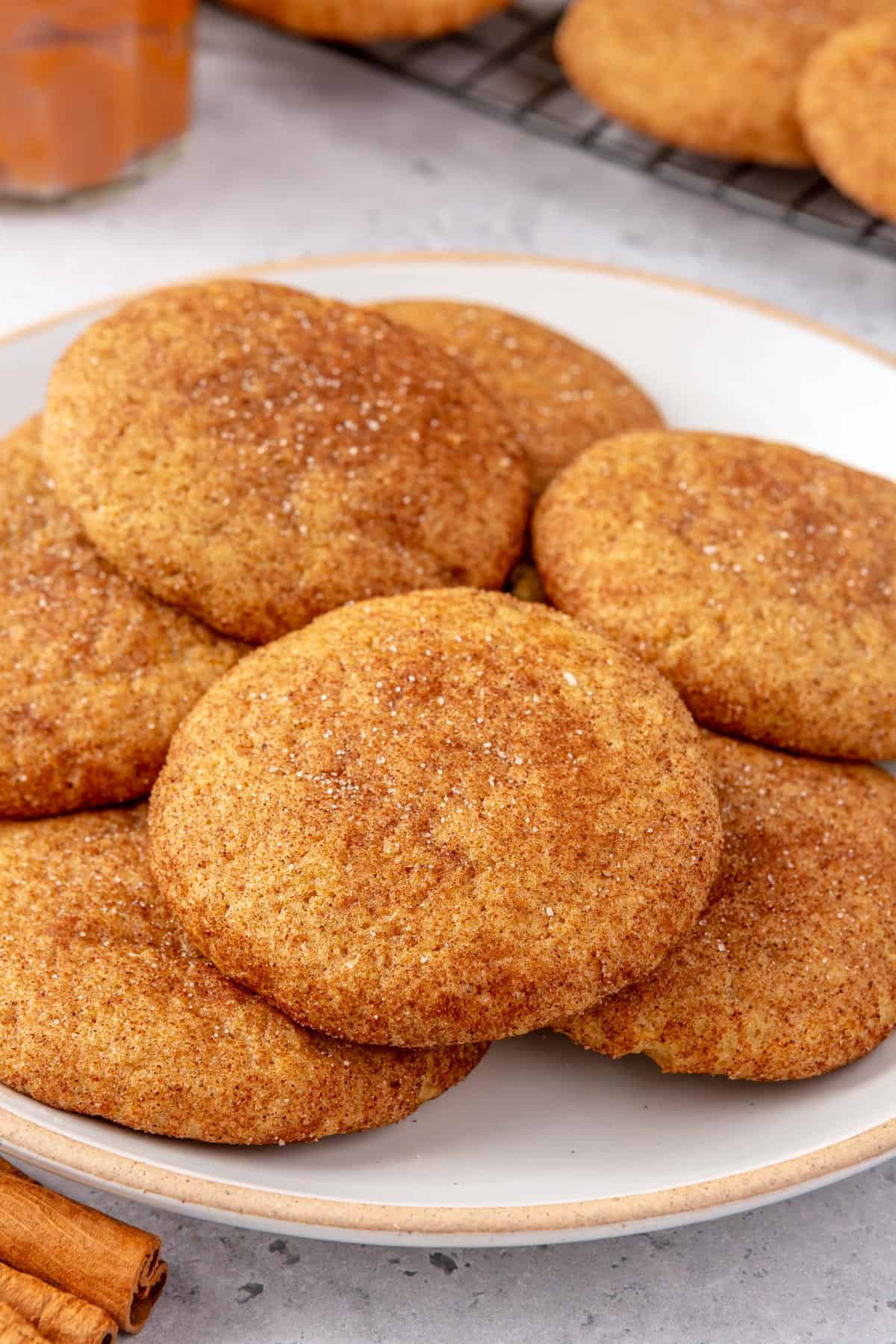 Pumpkin snickerdoodles on a plate.