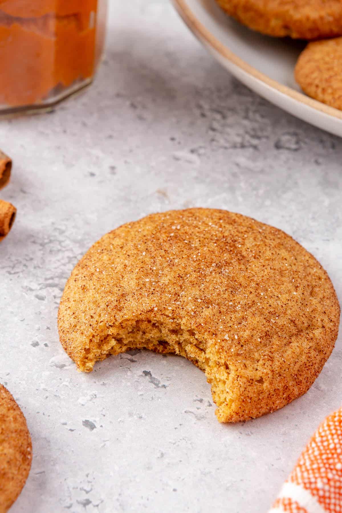 Chewy pumpkin snickerdoodle with a bite taken out.