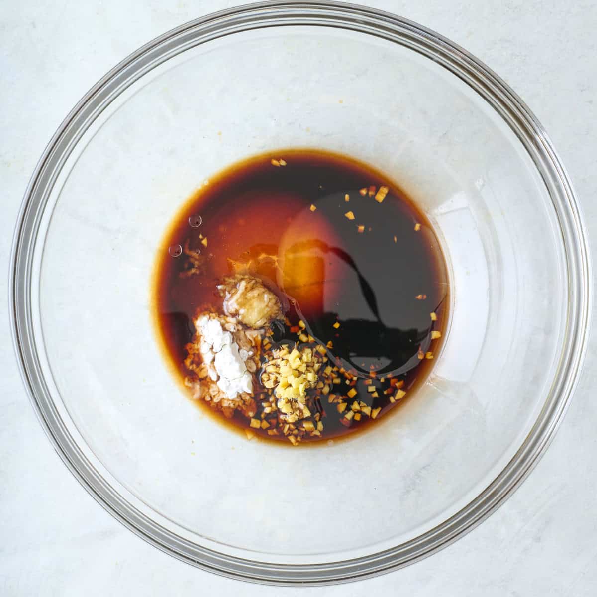 Sauce ingredients in a bowl before mixing.