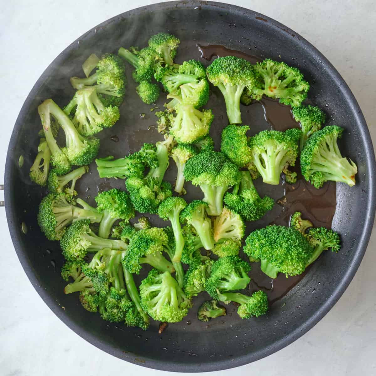 Broccoli after cooking with sauce.