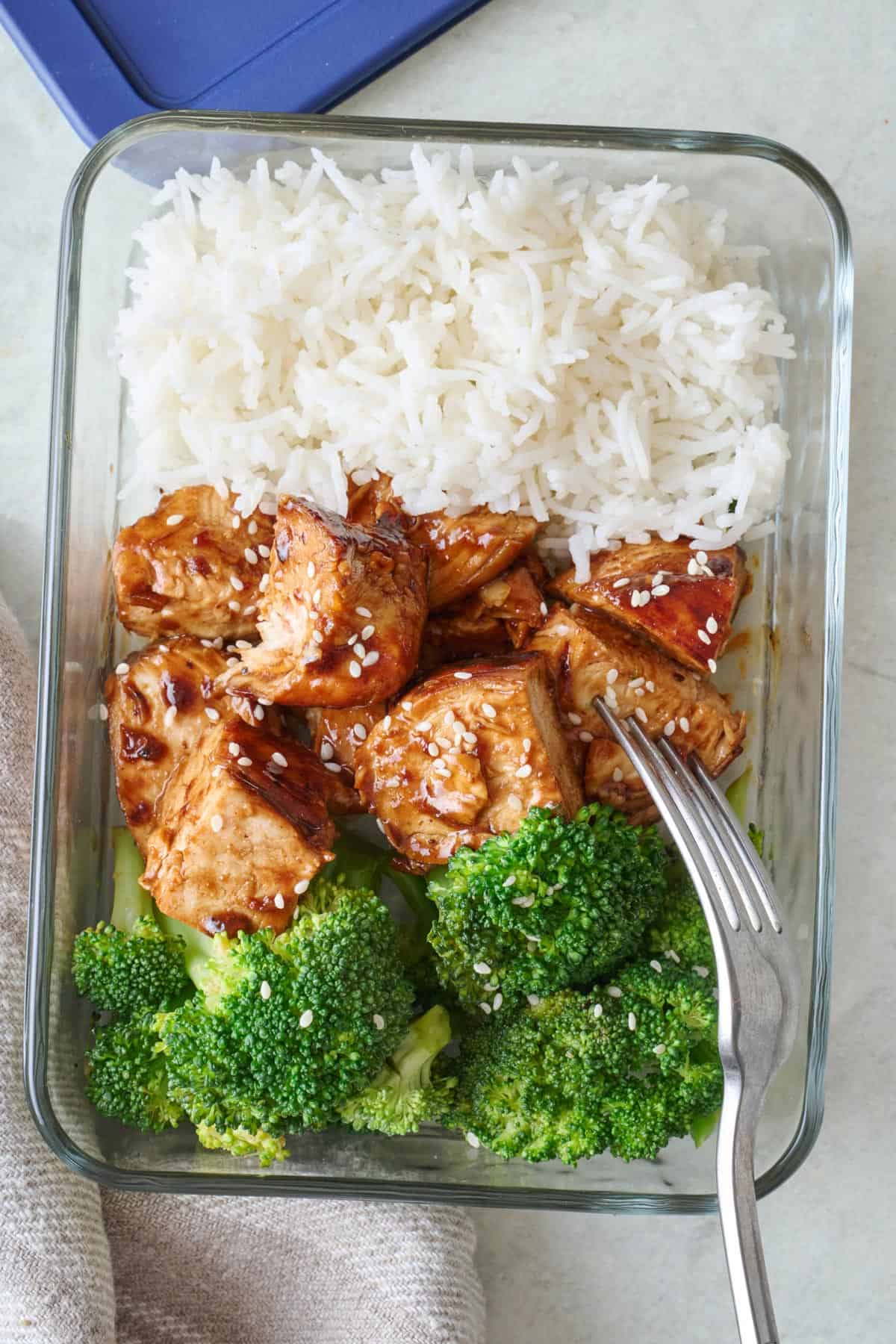 Teriyaki chicken meal prep container with rice and broccoli.