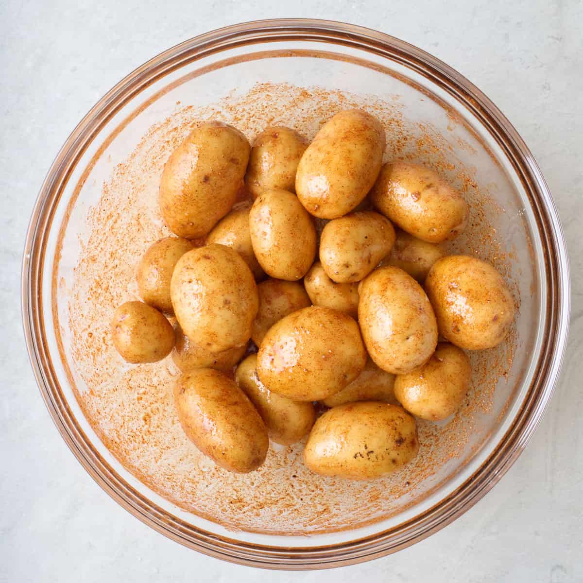 Baby potatoes tossed in oil and spices.