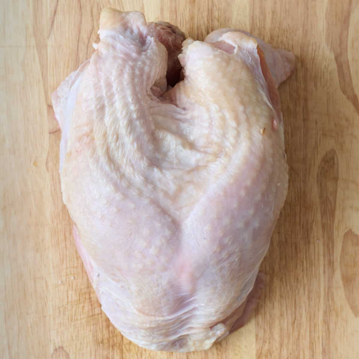 Turkey breast on cutting board.