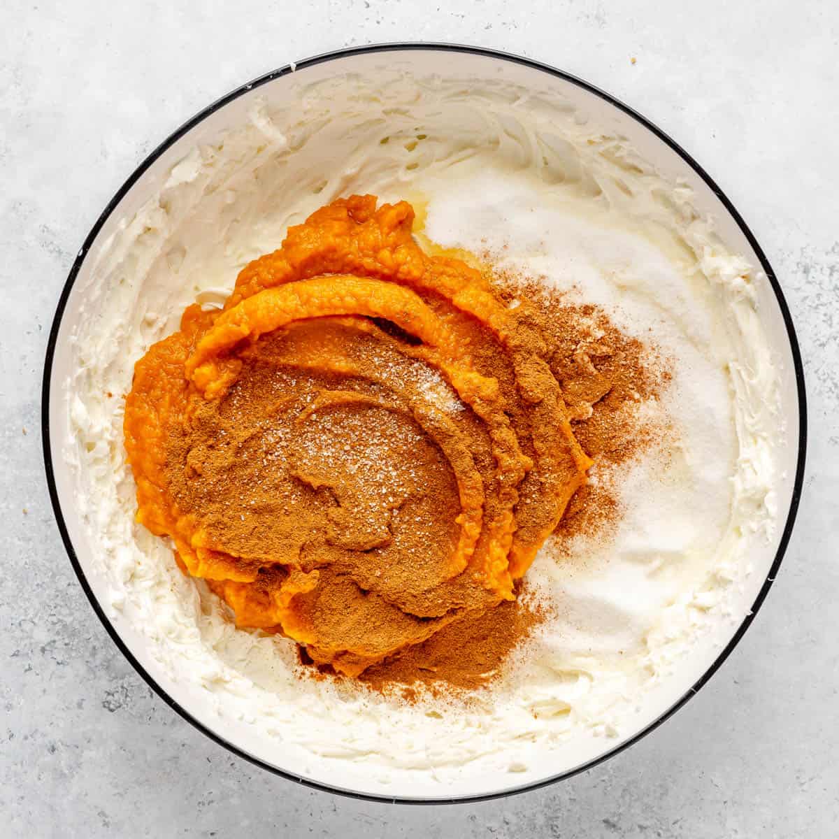 Sugar, pumpkin, salt and cinnamon added to whipped cream cheese.