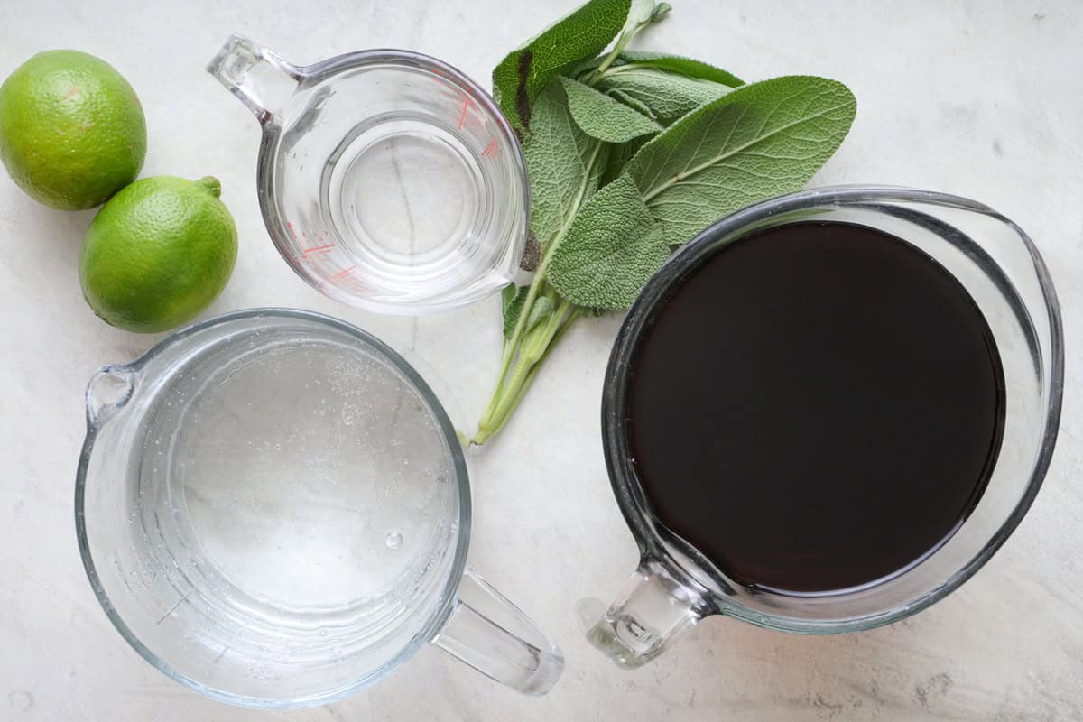 Ingredients for recipe: limes, simple syrup, club soda, sage, and pomegranate juice.