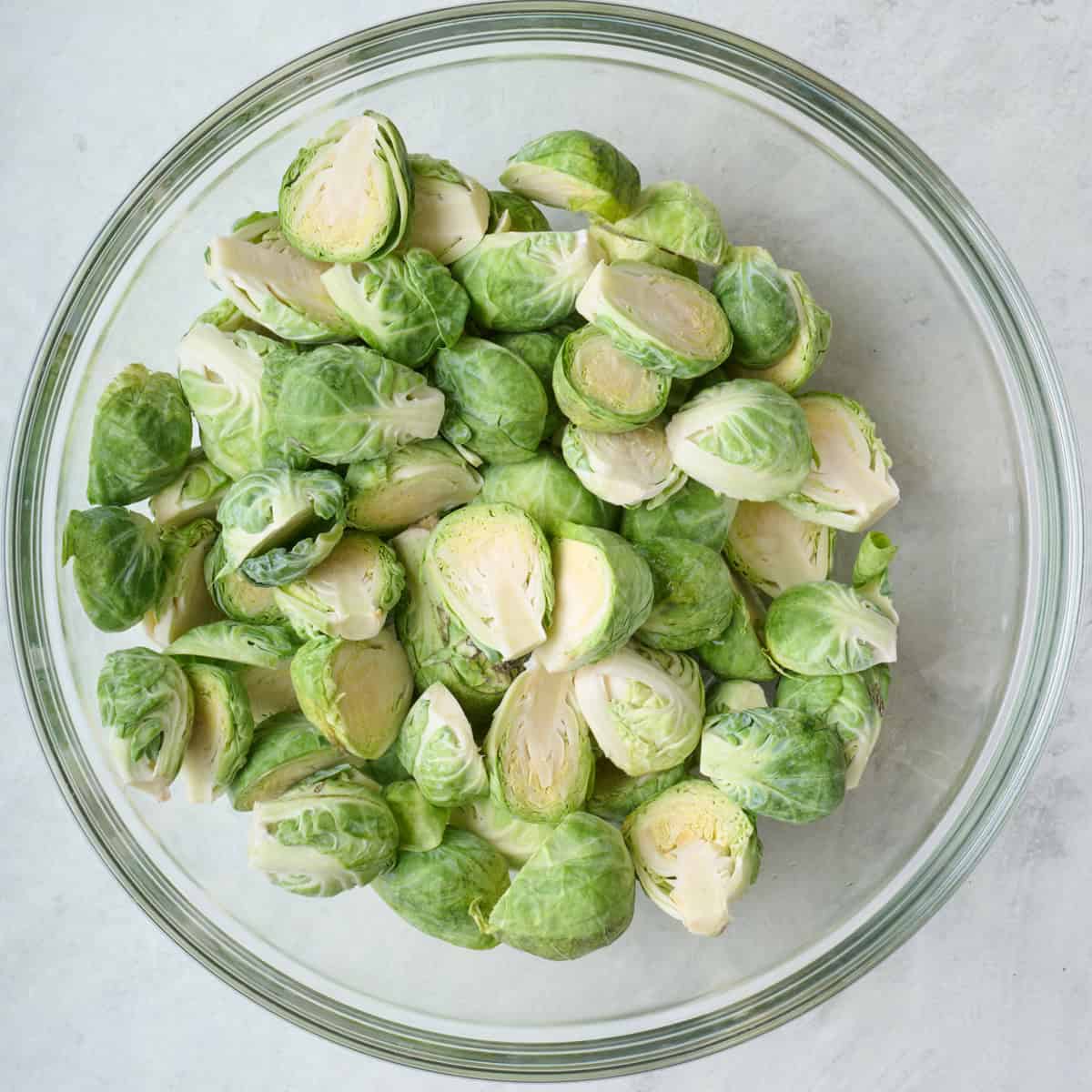 Halved brussel sprouts in a bowl.