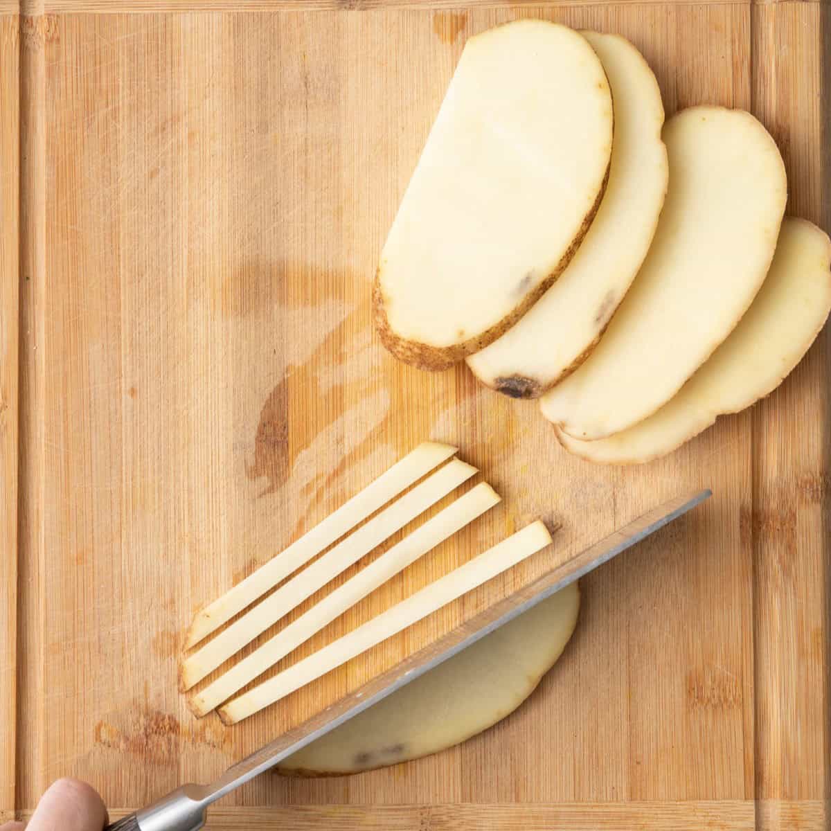 Cutting pot planks into sticks.