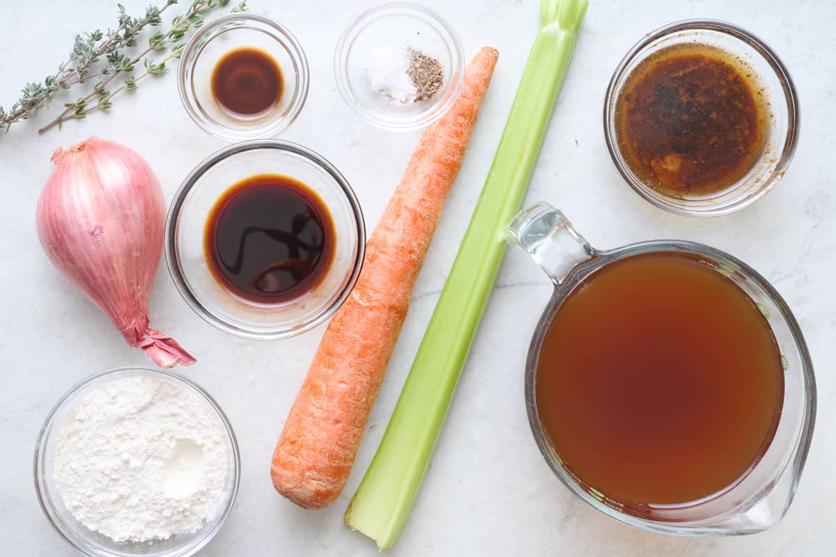 Ingredients for recipe: fresh herbs, shallot, flour, soy sauce, Worcestershire sauce, salt and pepper, carrot, celery, beef broth, and beef drippings.