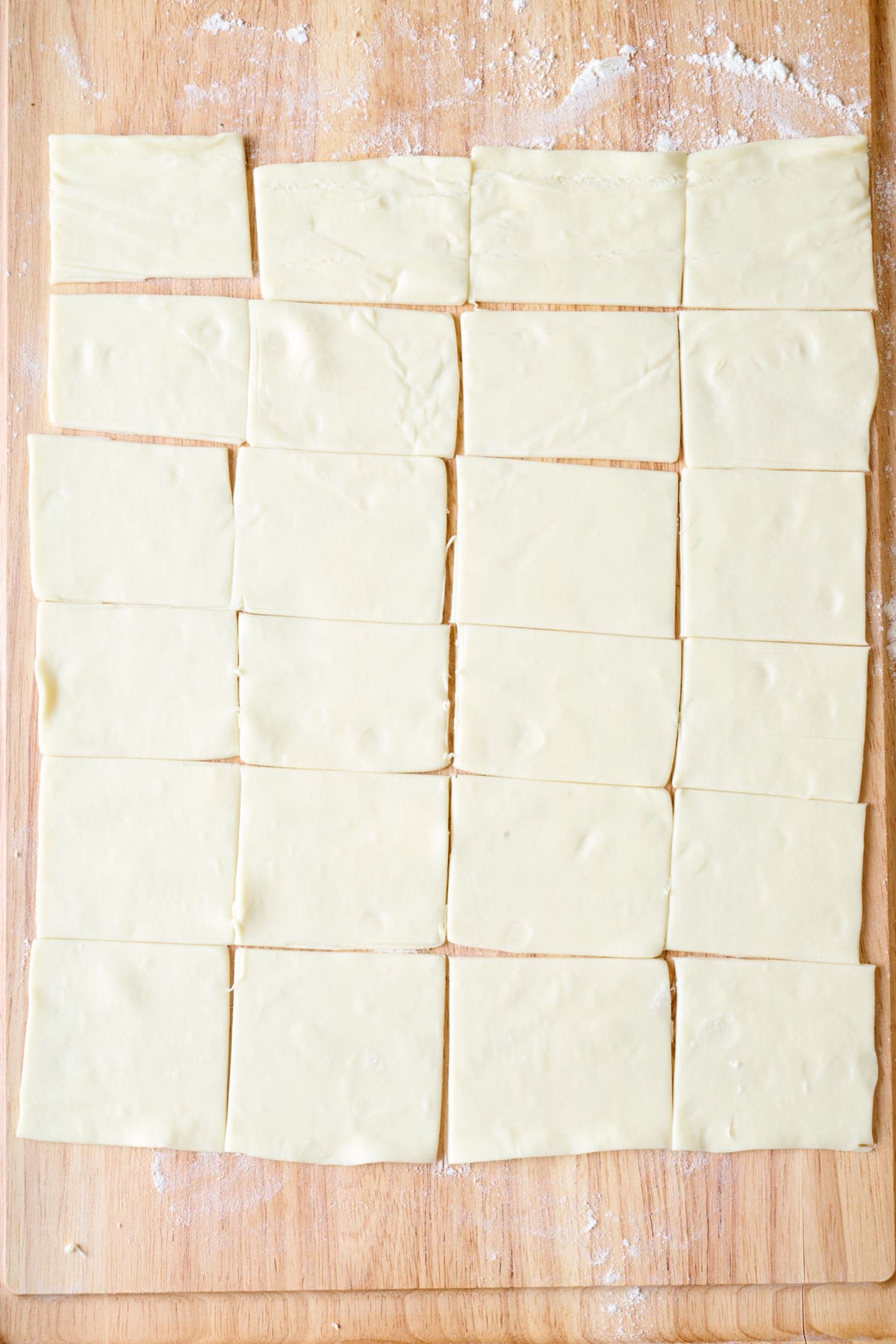 Puff pastry after cutting into 24 squares.