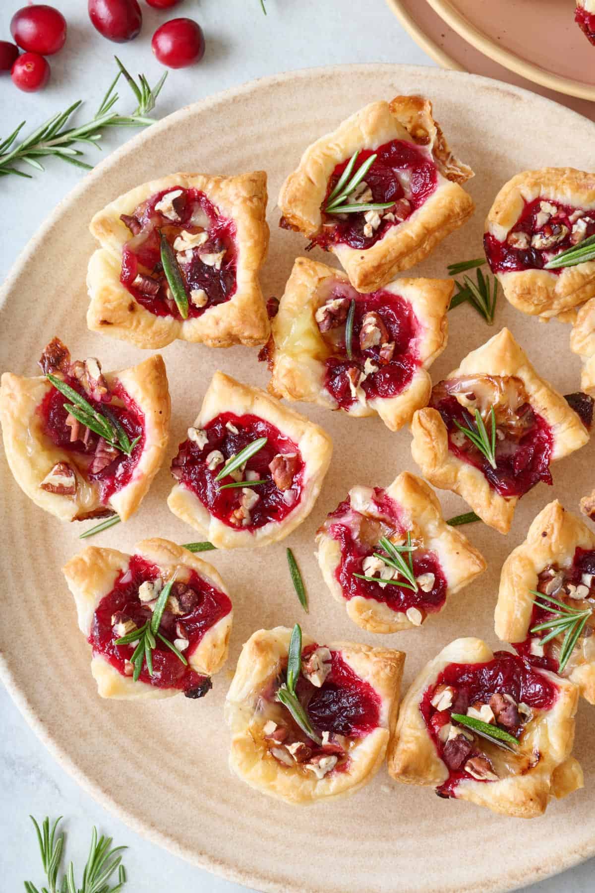 Cranberry brie bites on a platter.