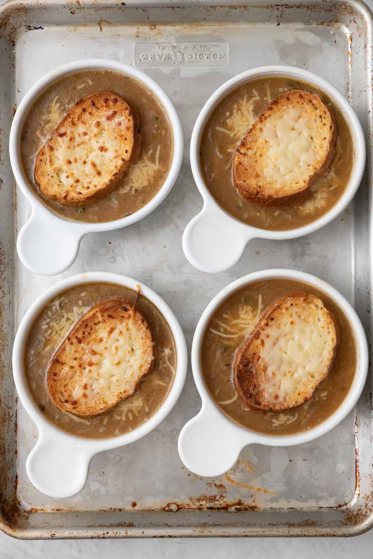 After broil soup bowls until cheese is browned and melty.