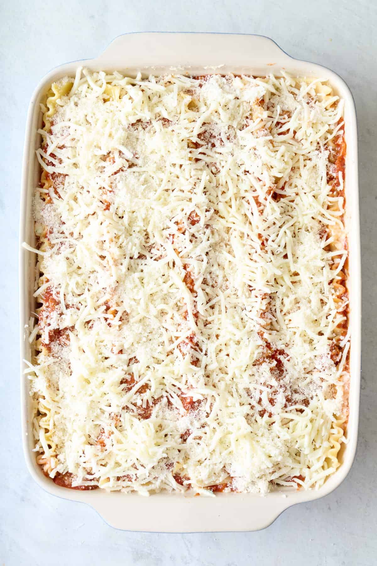 Final assembled lasagna in a baking dish before baking.