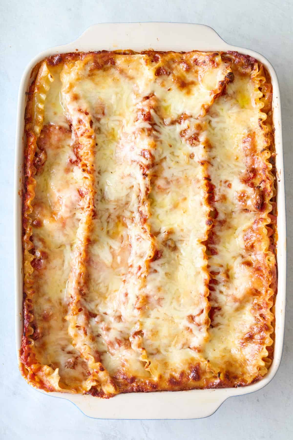 Final assembled lasagna in a baking dish after baking.