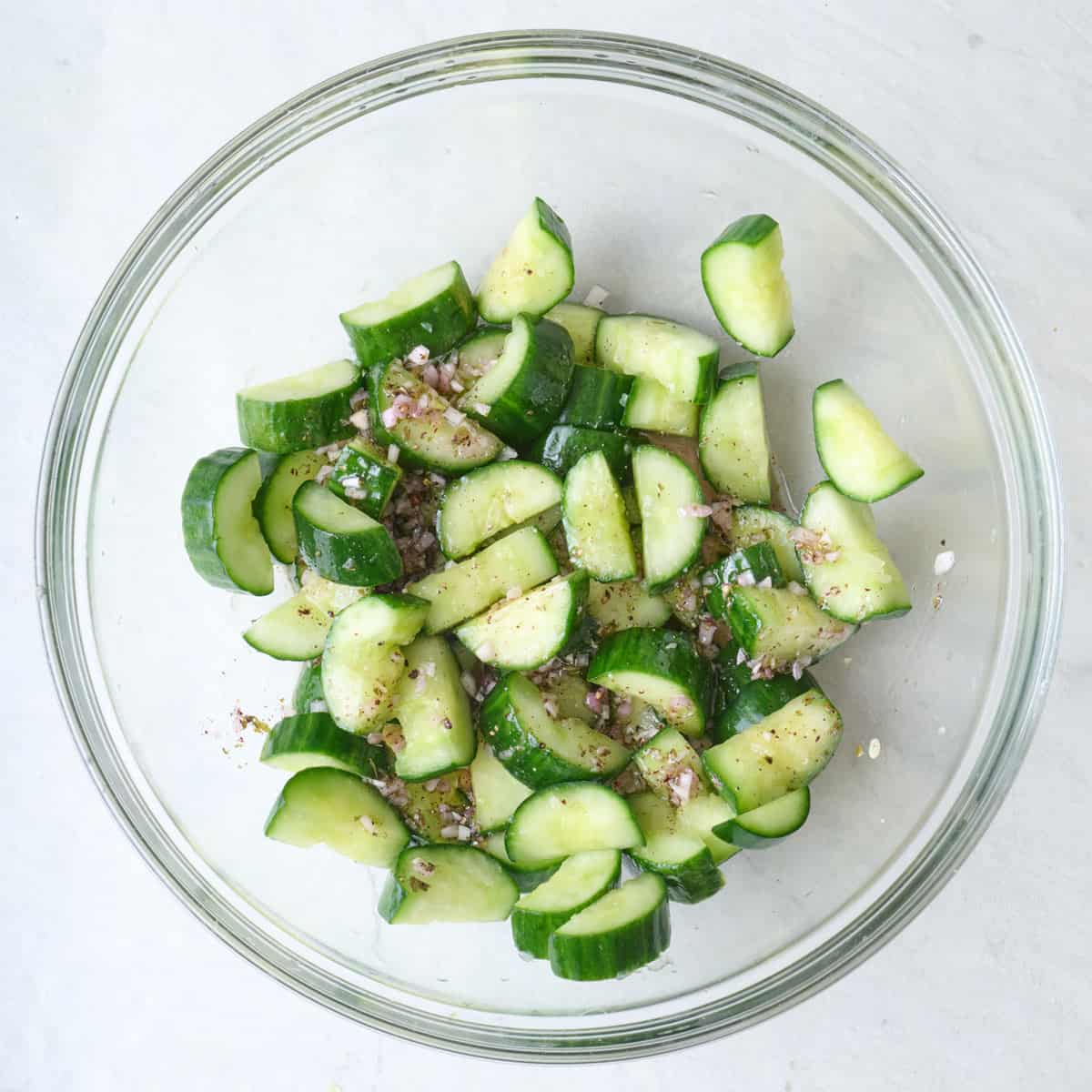 Cucumbers tossed in dressing.