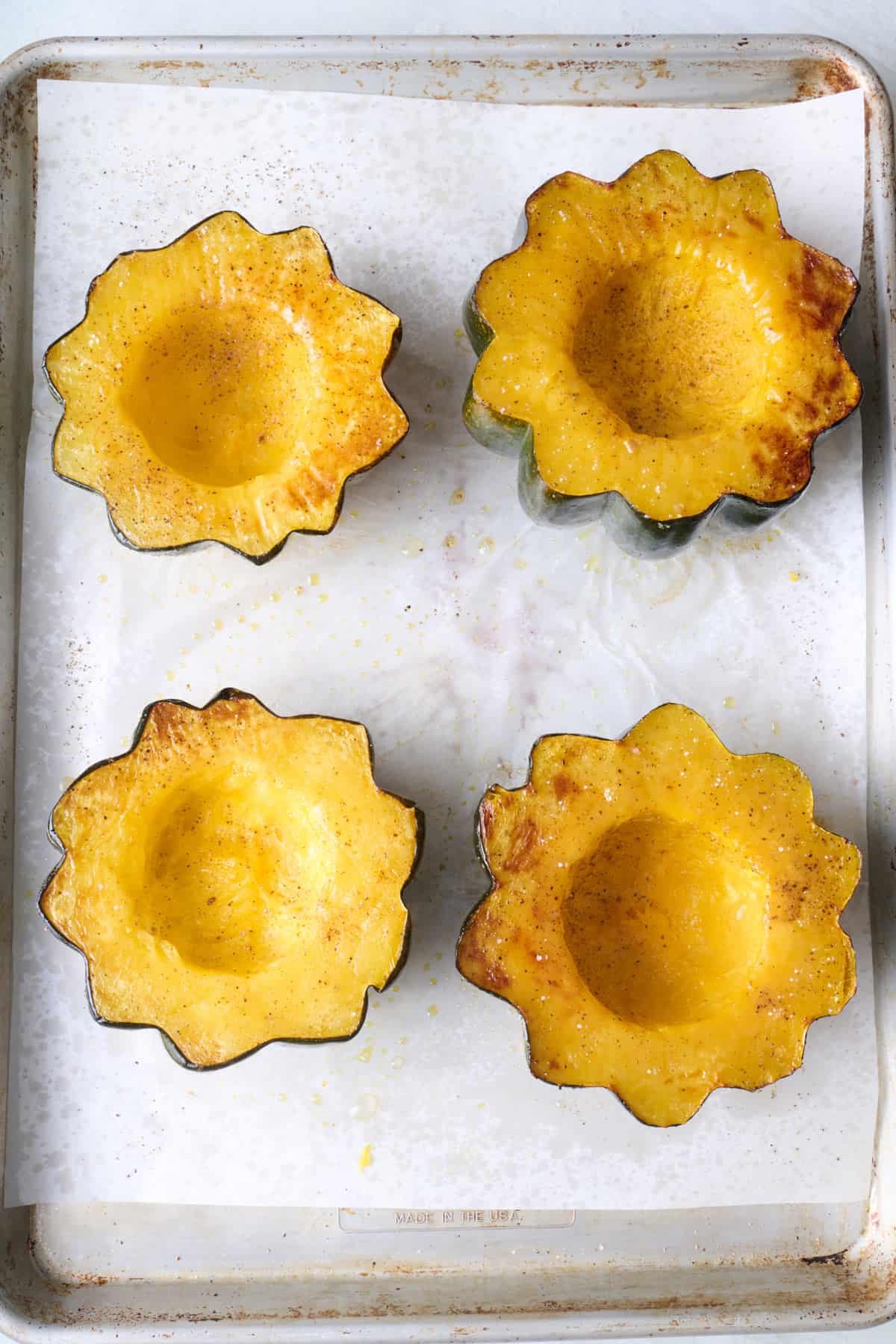 Squash halves after roasting and flipped flesh side up.