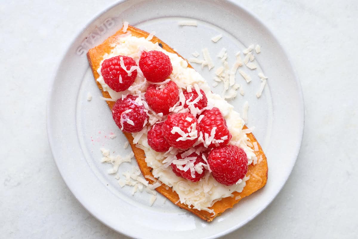 Ricotta cheese with raspberries and coconut sweet potato toast.