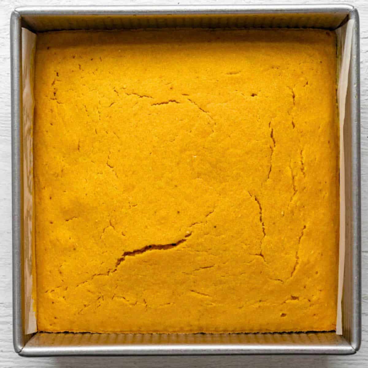 Non-dairy cornbread after baking in square baking pan.