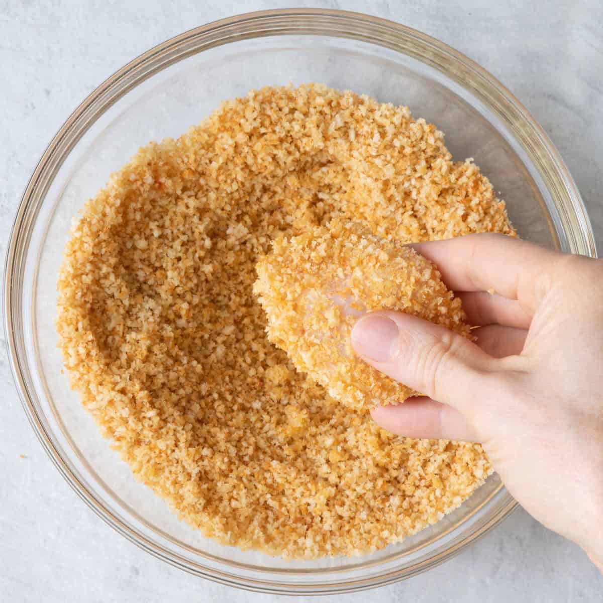 Chicken after coating with breadcrumbs.