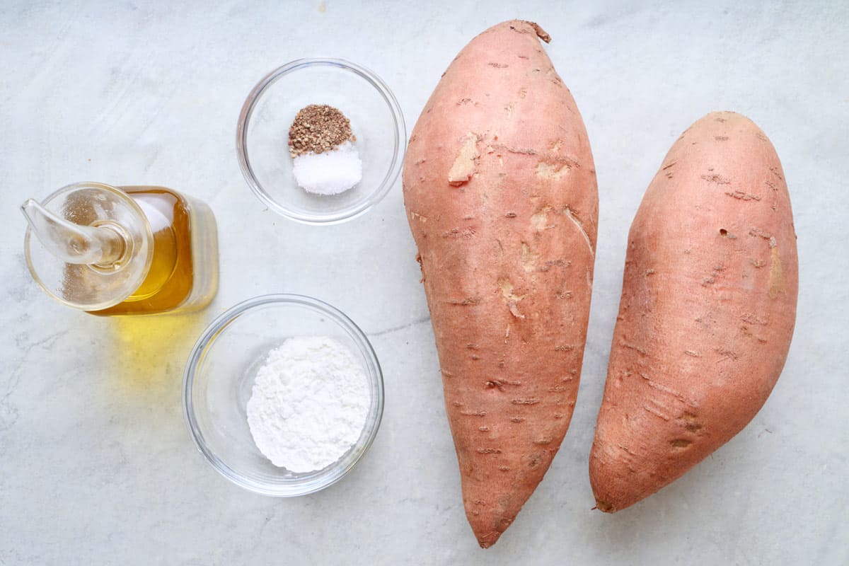 Ingredients for recipe: oil, salt, pepper, cornstarch, and sweet potatoes.