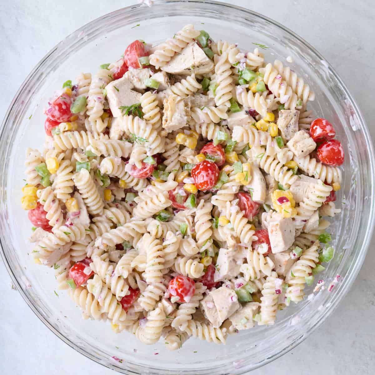 Pasta salad after tossing together.