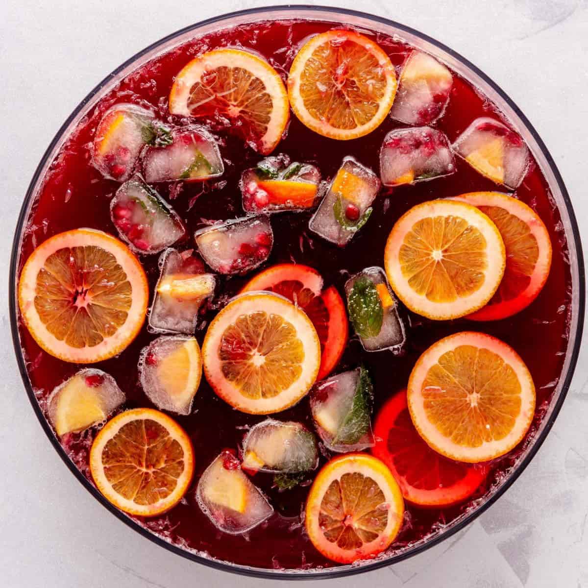 Festive ice cubes added to punch in a bowl.