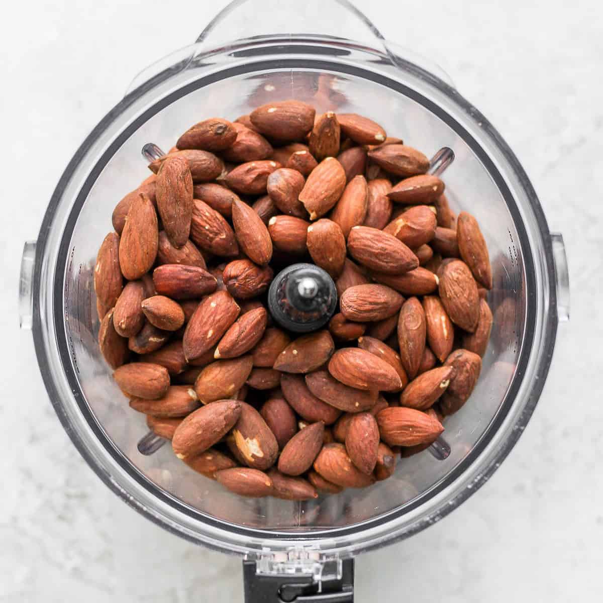 Roasted almonds in a food processor.