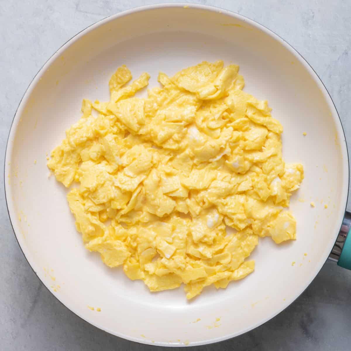 Scrambled eggs in pan after cooking.