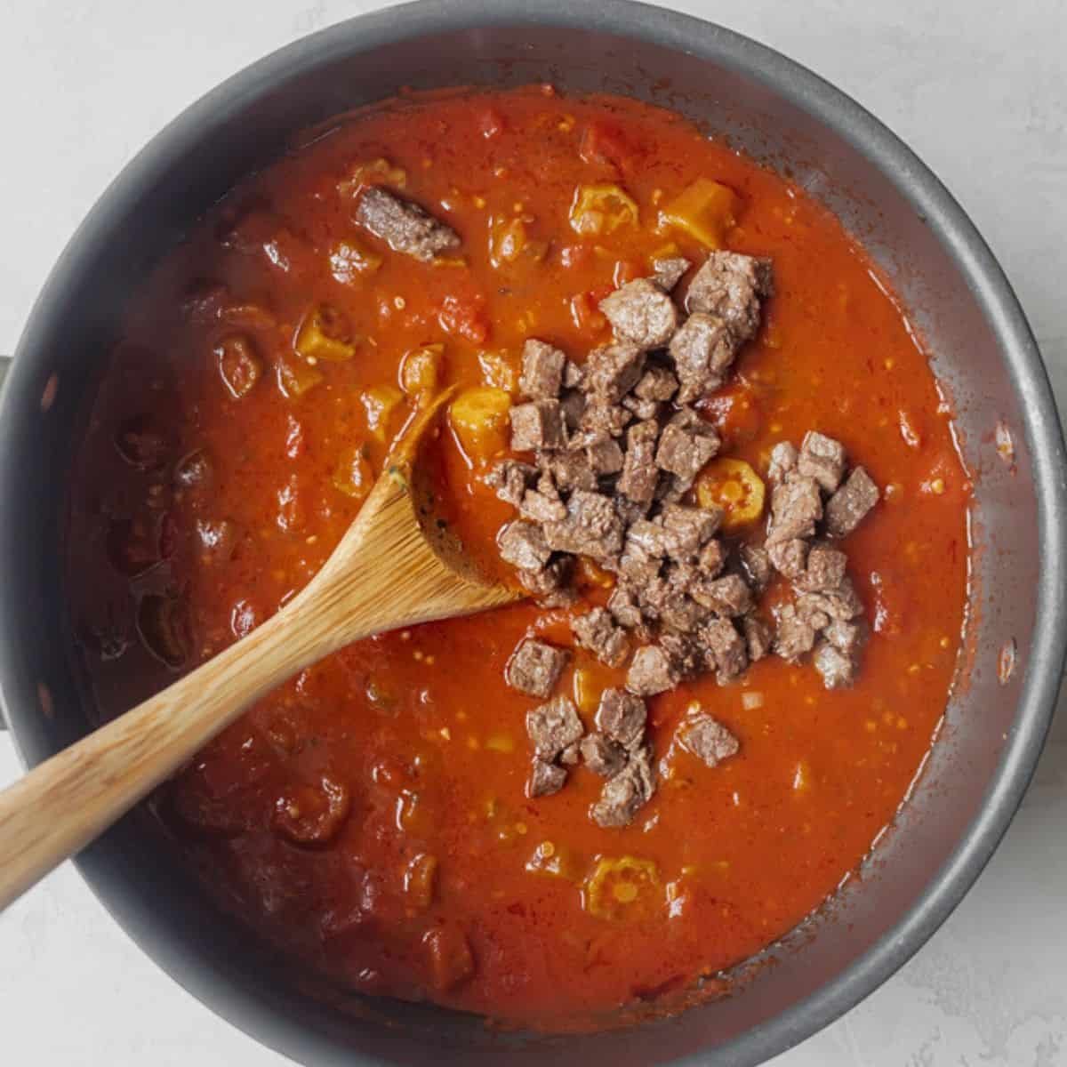 Browned cubed beef added to stew.