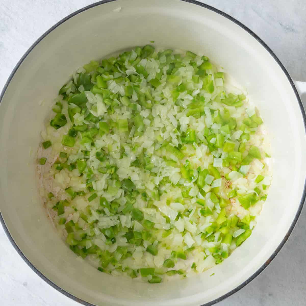 Onions and peppers in a pot after cooking.