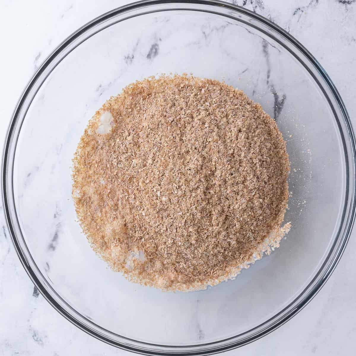 Milk and wheat bran in a bowl before mixing.