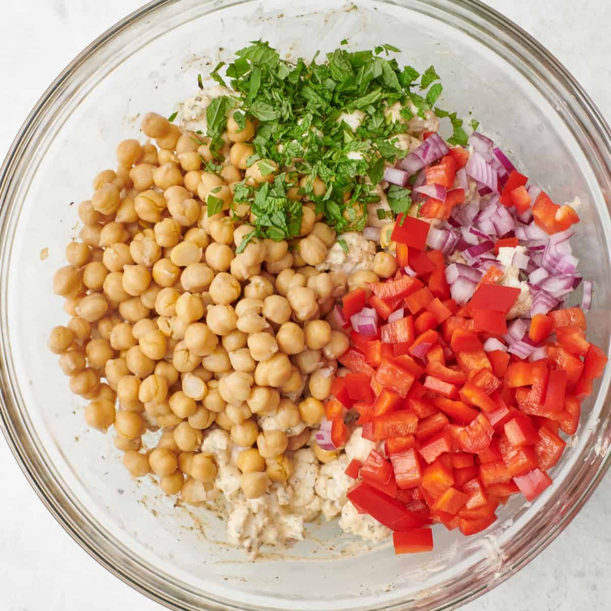 Chickpeas, red peppers, red onions, and mint added before combining.