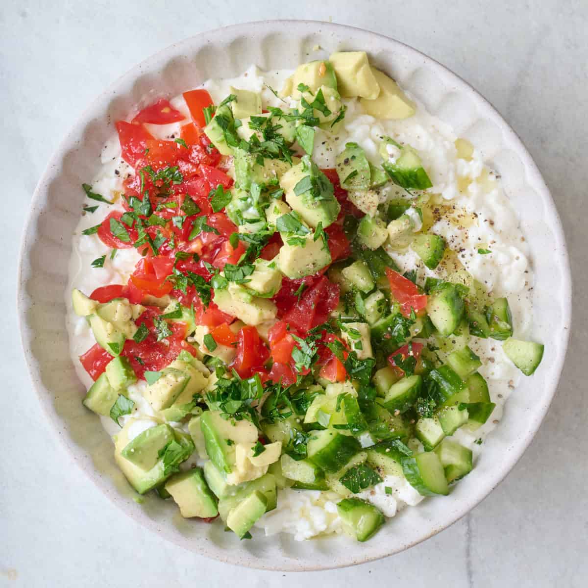 Final bowl with chopped veggies, herbs and seasoning added.