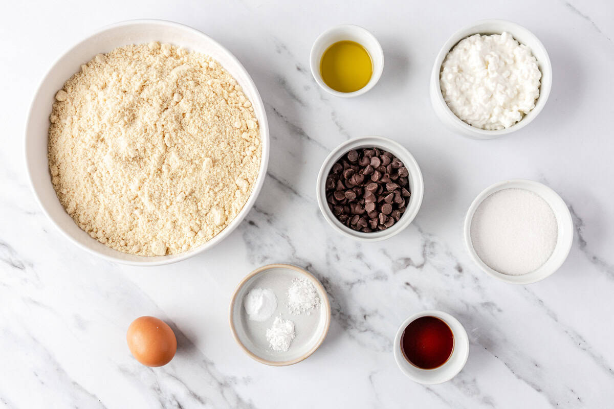 Ingredients for recipe: almond flour, egg, oil, vanilla, baking powder, baking soda, chocolate chips, sugar.