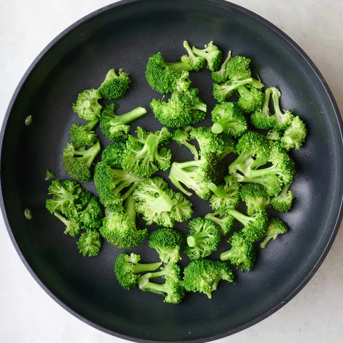 Broccoli in skillet after steaming.