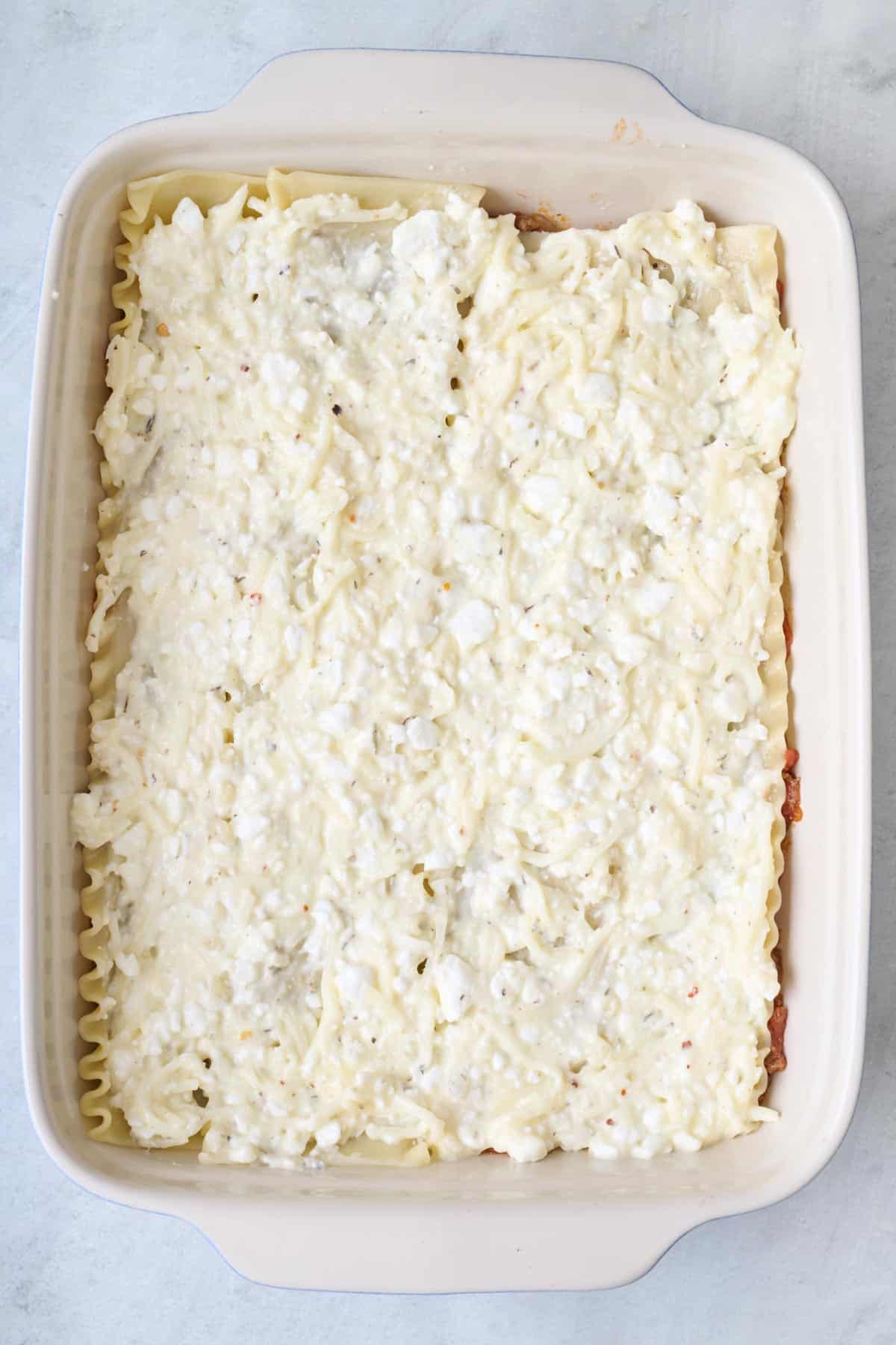 Cottage cheese mixture added on top of pasta.