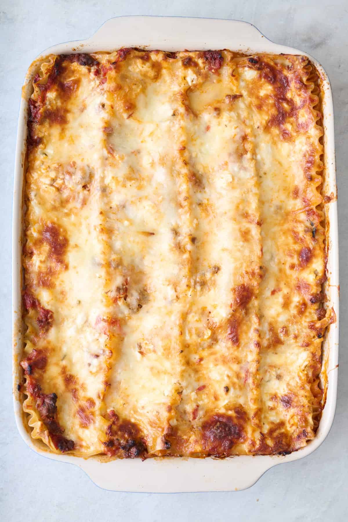 Lasagna after baking to show golden brown color and bubbly cheese.