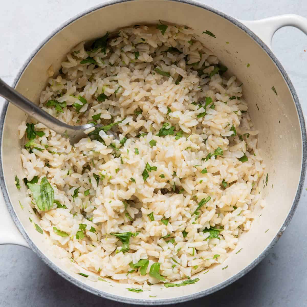 Cilantro stirred into rice.