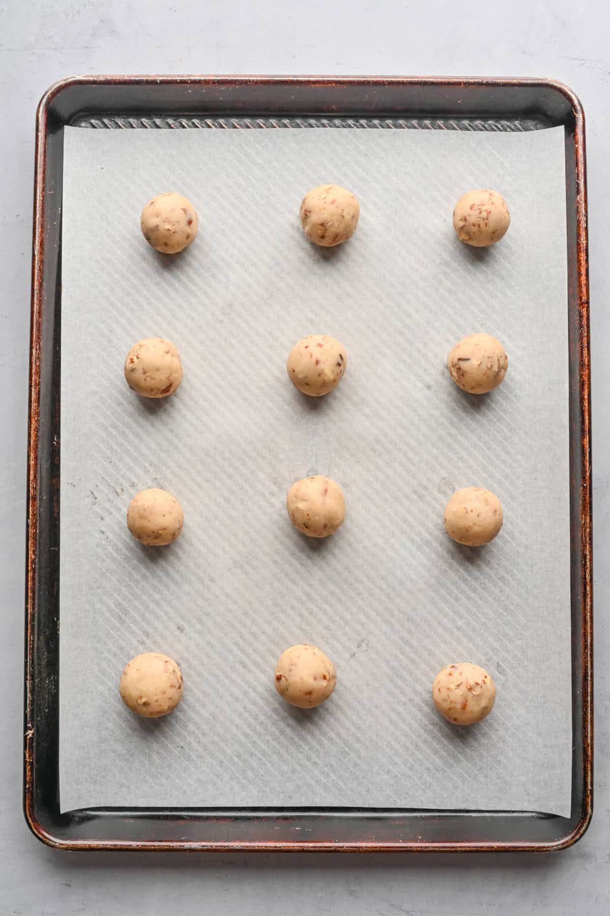 Tray of cookie dough balls before baking.