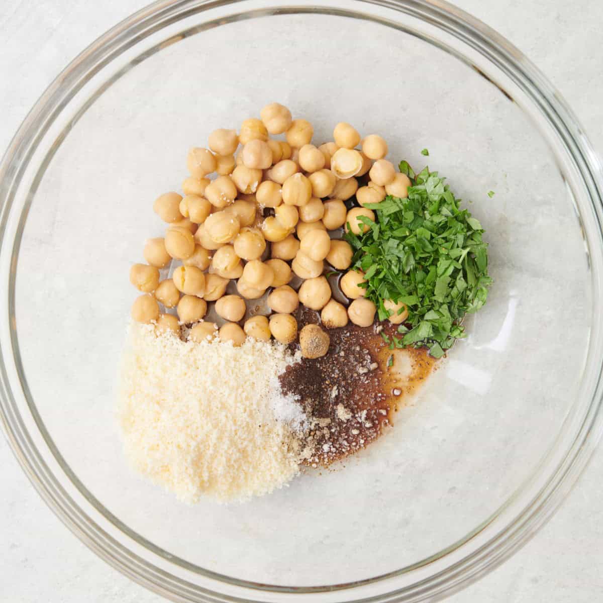 Stuffing ingredients in a bowl before combining.