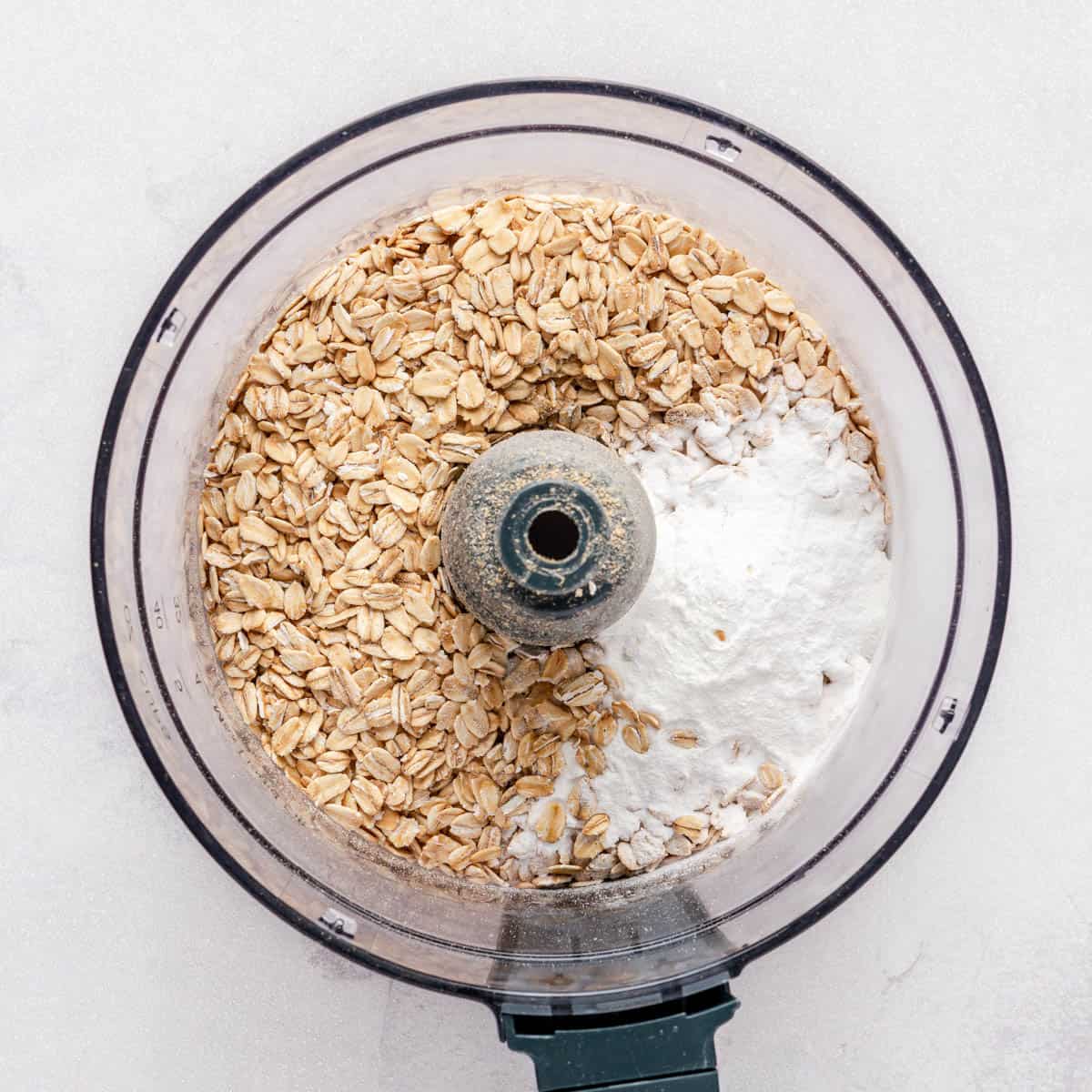 Oats, baking powder and salt in a food processor.