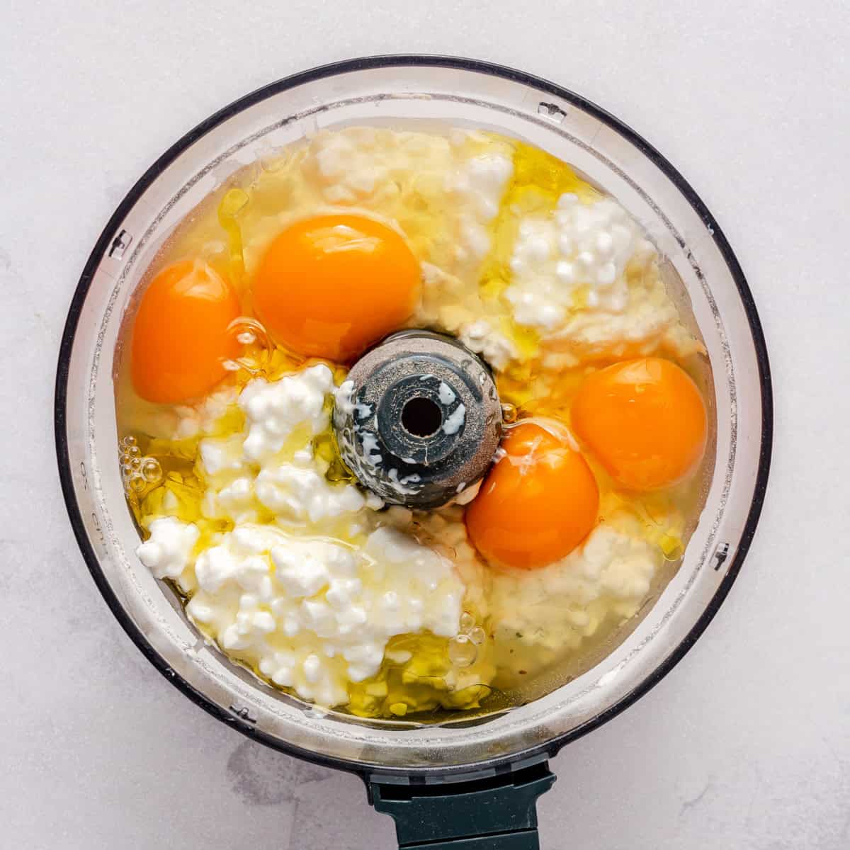 Cottage cheese, eggs and oil added on top of oat mixture.