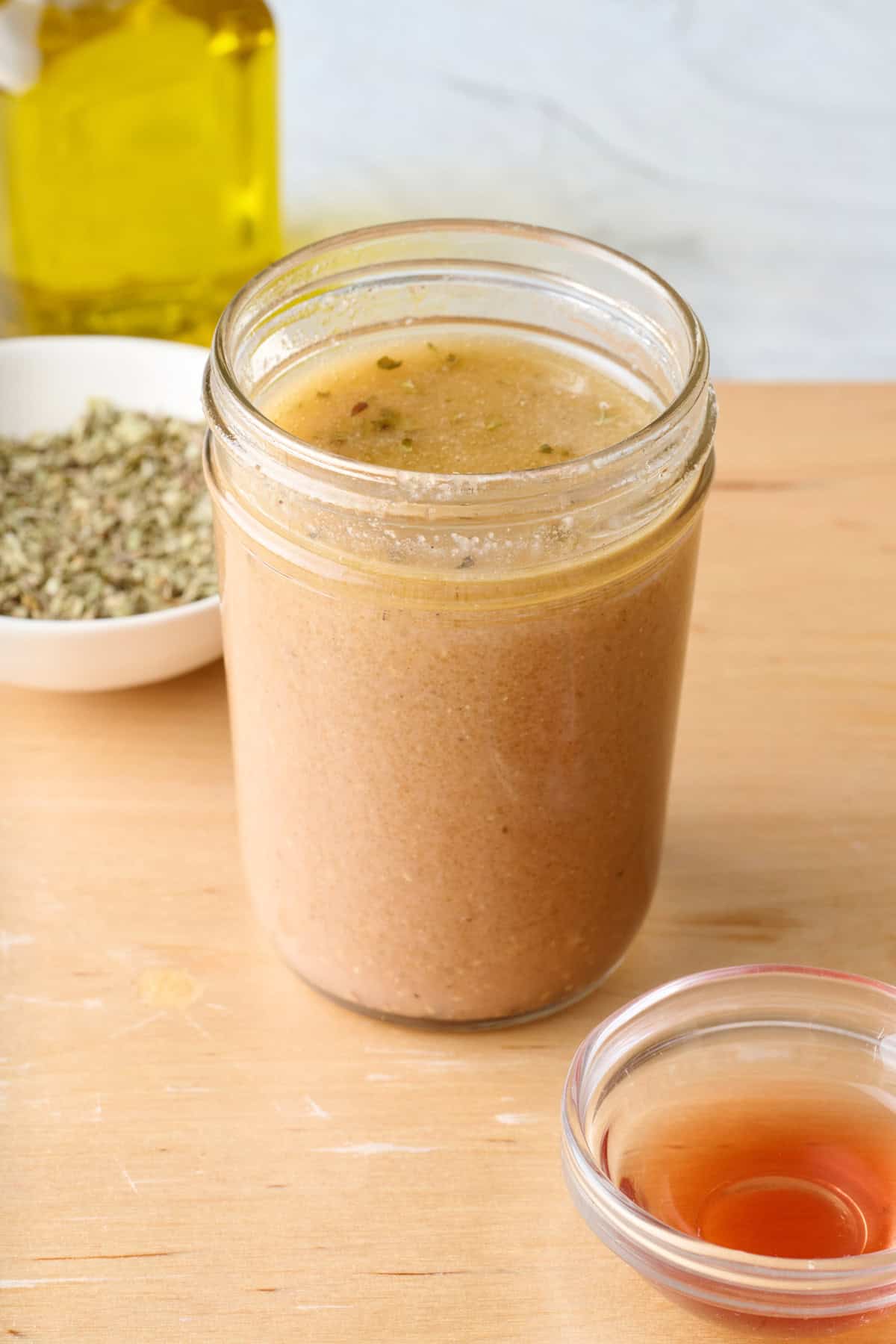 8 oz mason jar of homemade Greek dressing.