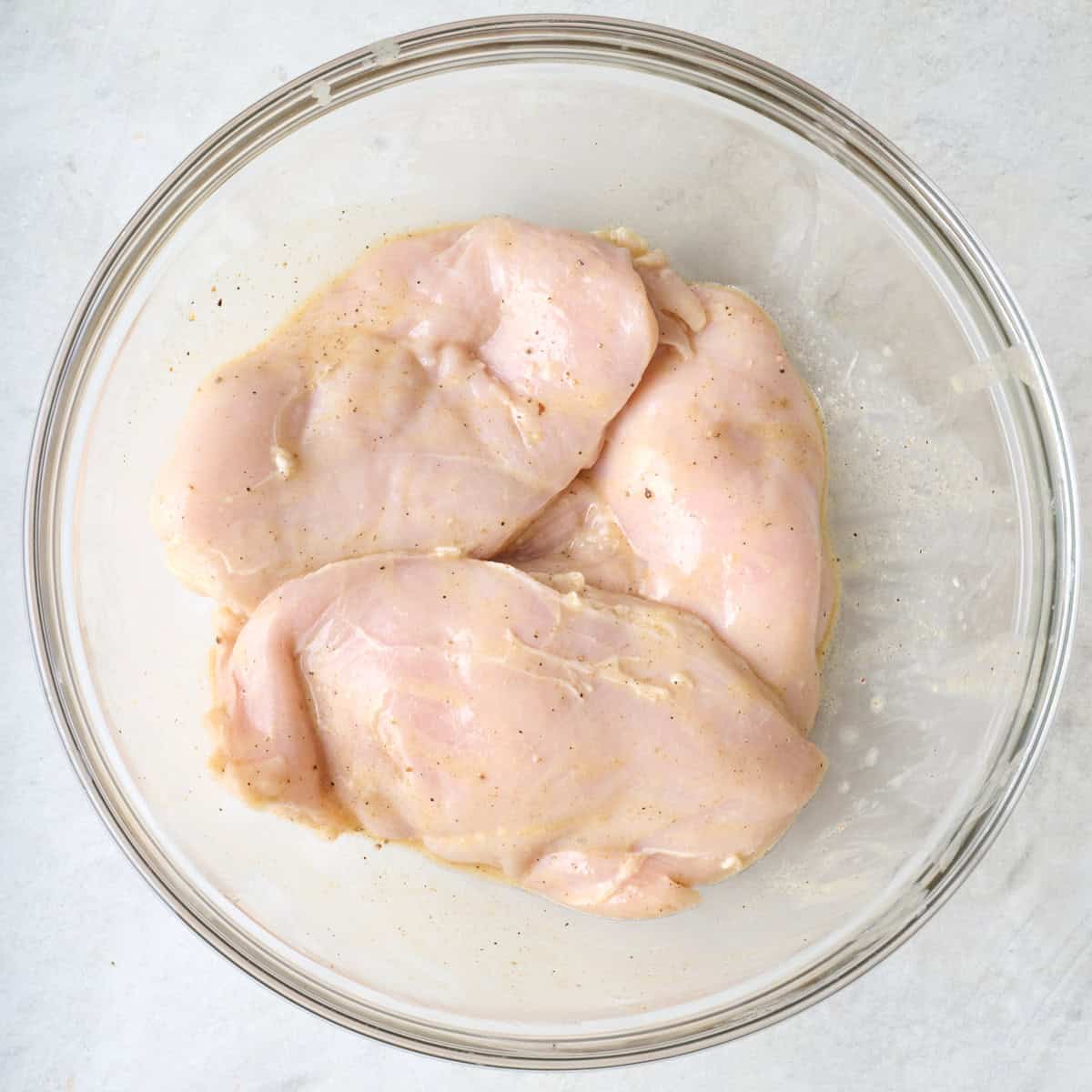 Chicken breasts in marinade.